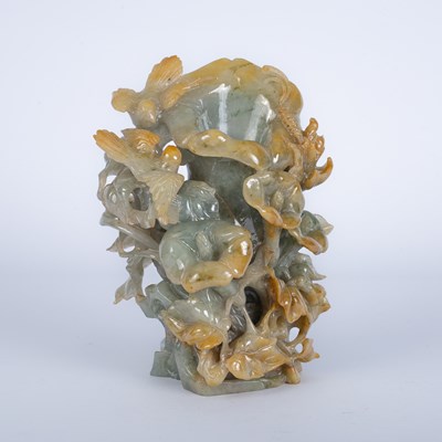 Lot 590 - A jade carving depicting birds around flowers