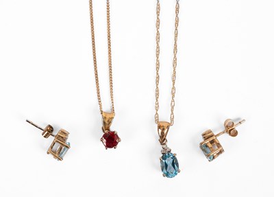 Lot 235 - A yellow metal topaz and diamond pendant and earring set