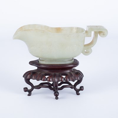Lot 598 - A Chinese pale celadon jade pouring vessel