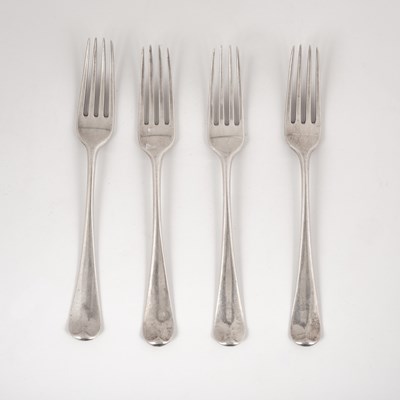 Lot 22 - A set of four George III silver table forks