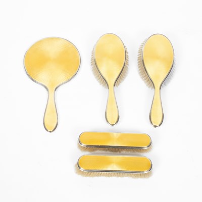 Lot 11 - A silver and yellow enamel dressing table set