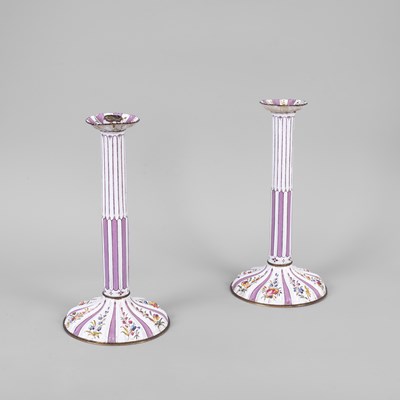 Lot 97 - A pair of Battersea English enamel candlesticks