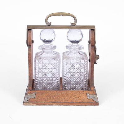Lot 340 - An Victorian oak framed two bottle tantalus