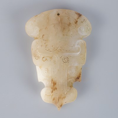 Lot 628 - A Chinese Shang style jade pendant