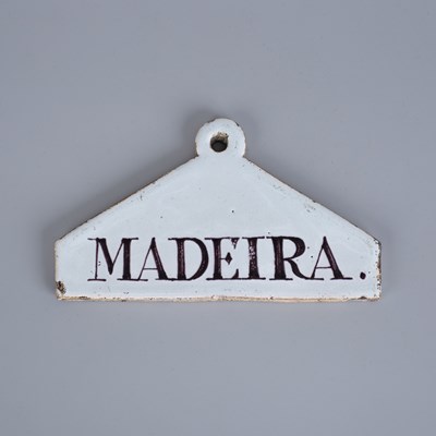 Lot 726 - An English Delftware wine label for Madeira
