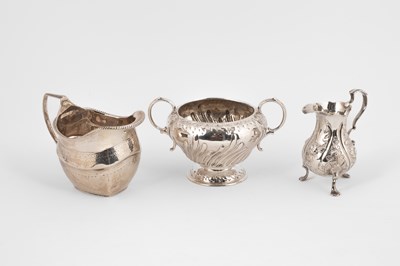 Lot 61 - A George III pear-shaped silver cream jug