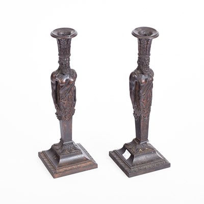 Lot 509 - A pair of early 19th Century Berlin well patinated cast-iron pedestal candlesticks