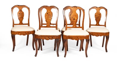 Lot 357 - A set of six Northern European fruitwood and marquetry inlaid dining chairs