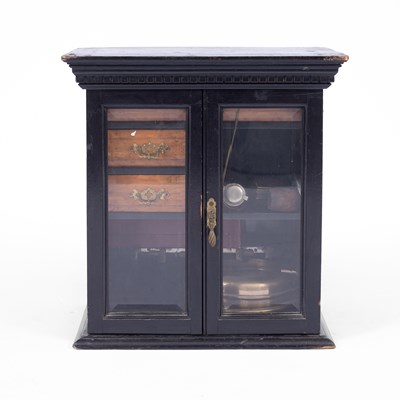 Lot 879 - An Edwardian ebonised smokers cabinet