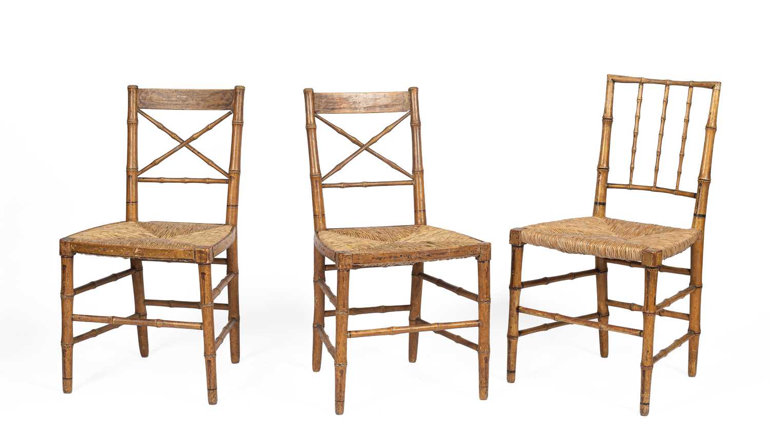 Lot 375 - A pair of Regency faux-bamboo carved and painted dining chairs