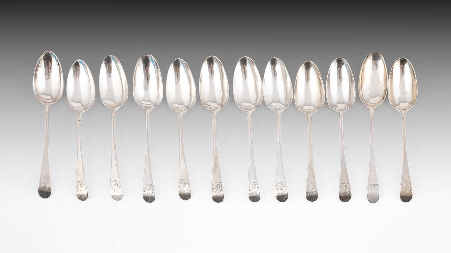 Lot 384 - Eleven George III silver dessert spoons
