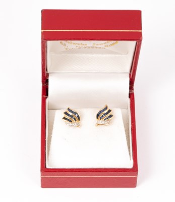 Lot 137 - A pair of yellow metal sapphire and diamond stud earrings