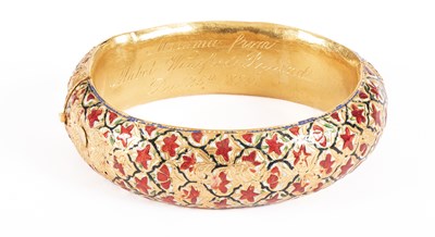 Lot 52 - A Victorian Anglo-Indian yellow metal and enamel hinged bangle