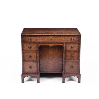 Lot 862 - A George I style burr walnut kneehole desk