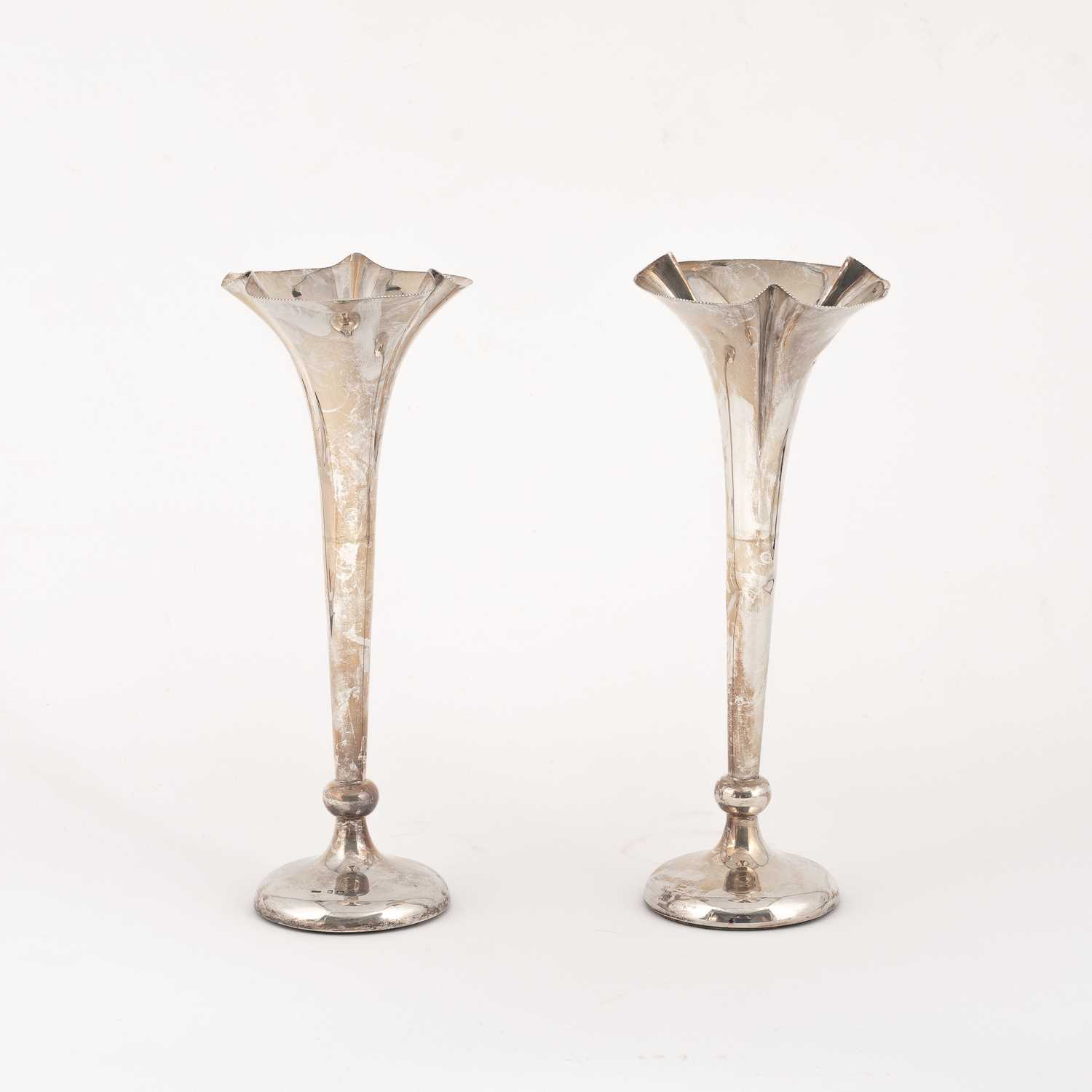 Lot 35 - A pair of silver tulip vases