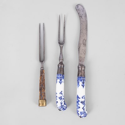 Lot 276 - A St Cloud porcelain pistol-grip handled knife and fork