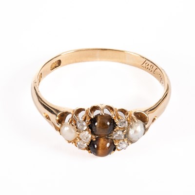 Lot 45 - A Victorian yellow metal tiger's eye, pearl and diamond ring