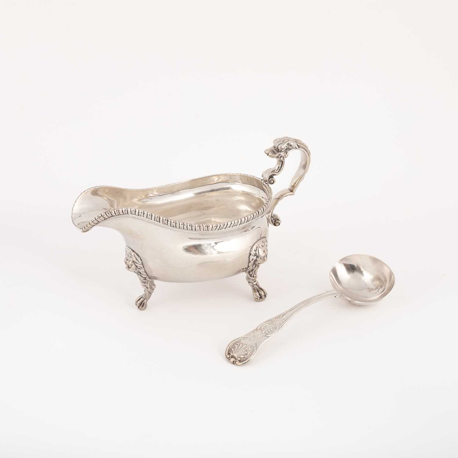 Lot 30 - A George II silver sauce boat