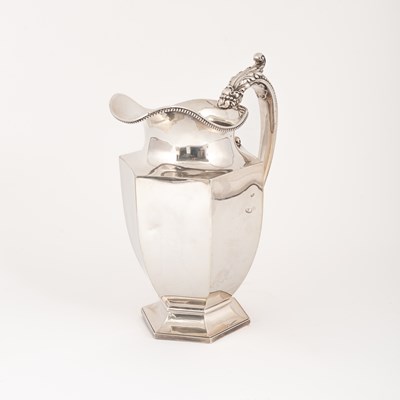 Lot 111 - A white metal jug