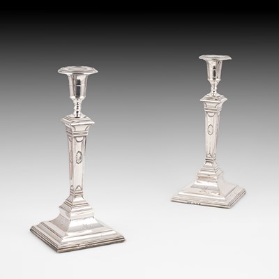 Lot 385 - A pair of George III silver candlesticks