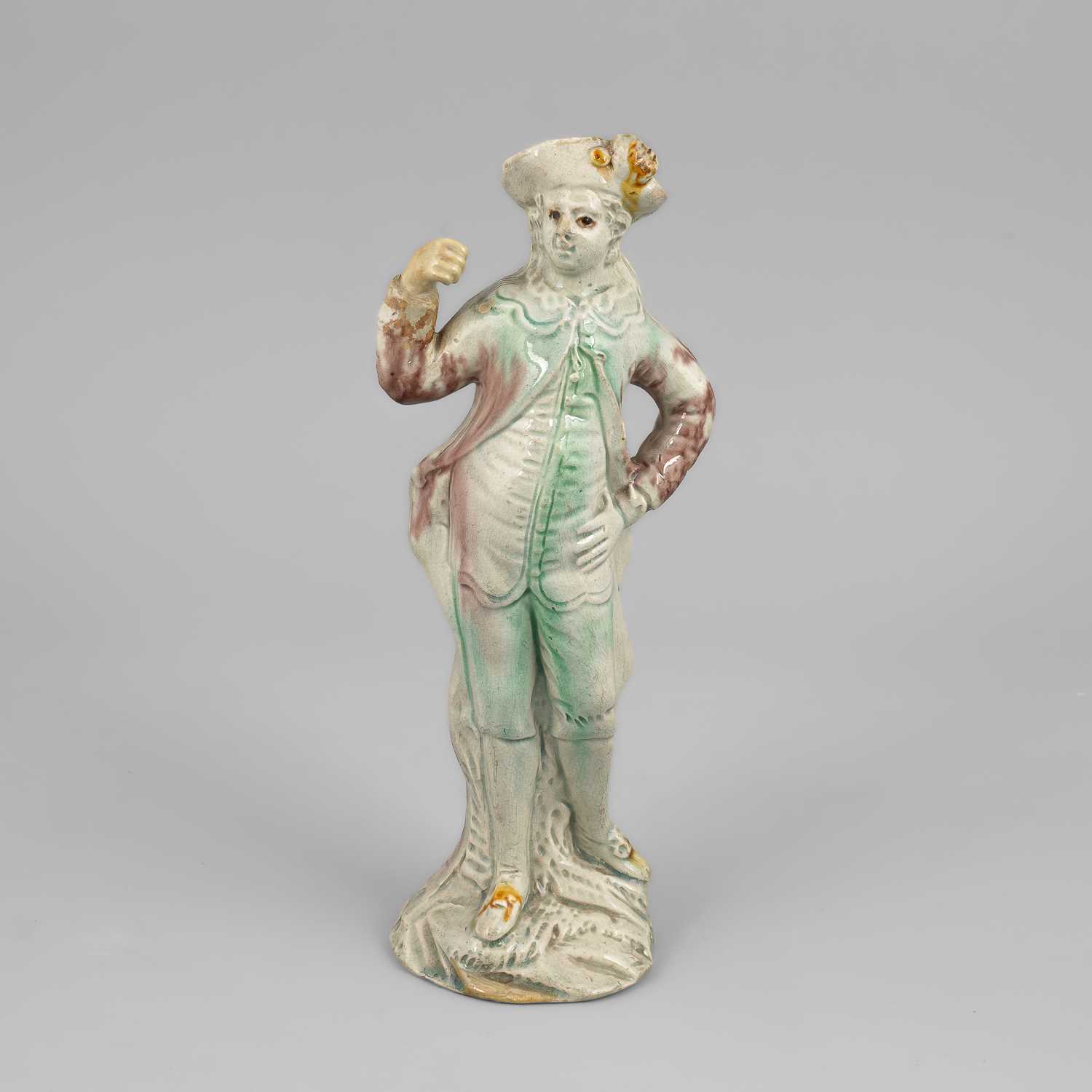 Lot 320 - A Staffordshire creamware figure of a gallant