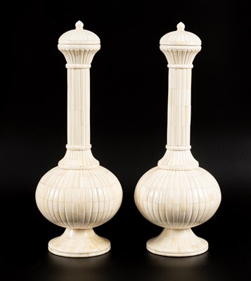 Lot 384 - A pair of camel bone vases and covers
