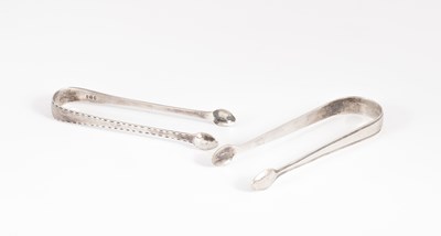 Lot 153 - Two pairs of George III silver sugar tongs