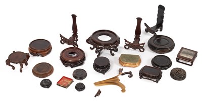 Lot 219 - A collection of Chinese hardwood bases for vases