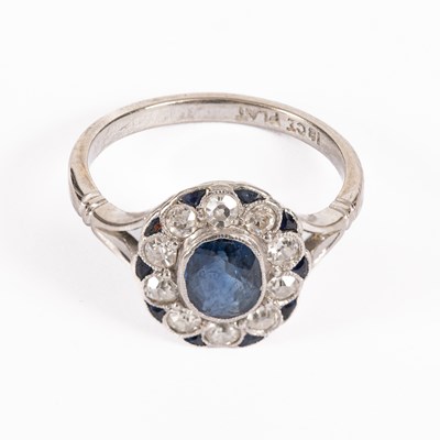 Lot 65 - A sapphire and diamond cluster ring