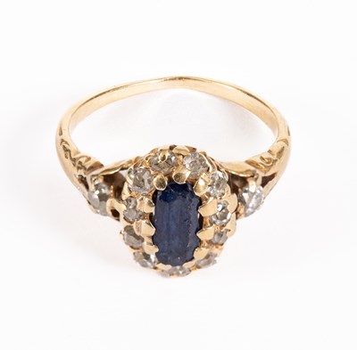 Lot 66 - A sapphire and diamond cluster ring