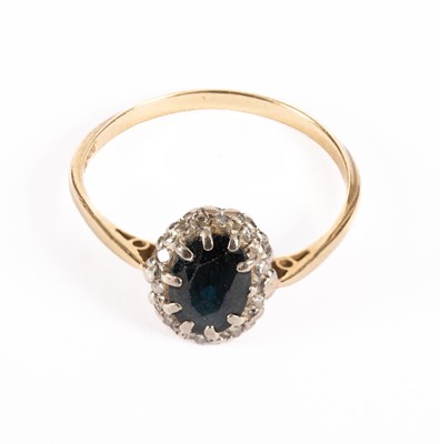 Lot 68 - A sapphire and diamond cluster ring