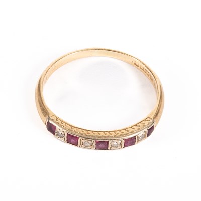 Lot 70 - A ruby and diamond half-hoop ring