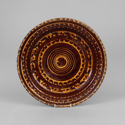 Lot 293 - A large English slipware circular dish