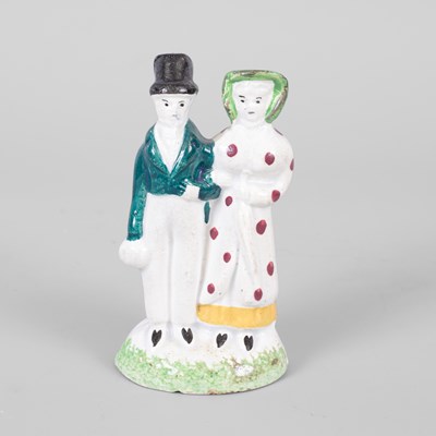 Lot 301 - A small pottery figure group of dandies