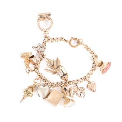 Lot 11 - A yellow gold charm bracelet
