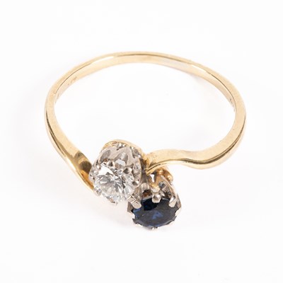 Lot 24 - A diamond and sapphire crossover ring