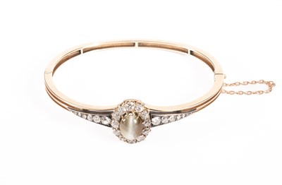 Lot 36 - A Victorian gold, diamond and chrysoberyl cat's eye bangle