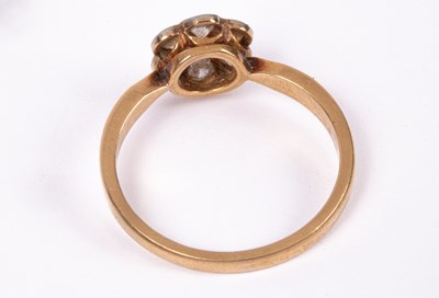 Lot 76 - An Edwardian 18ct gold and diamond flower head ring