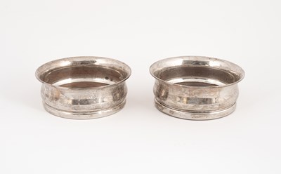 Lot 118 - A pair of silver wine coasters