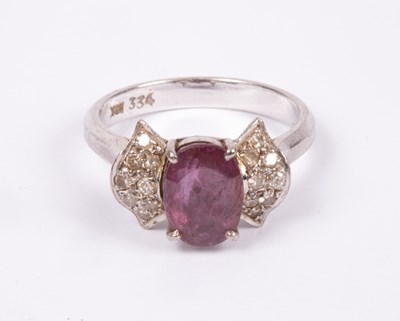 Lot 42 - An 18K white gold ruby and diamond ring