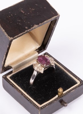 Lot 42 - An 18K white gold ruby and diamond ring