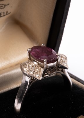 Lot 42 - An 18K white gold ruby and diamond ring
