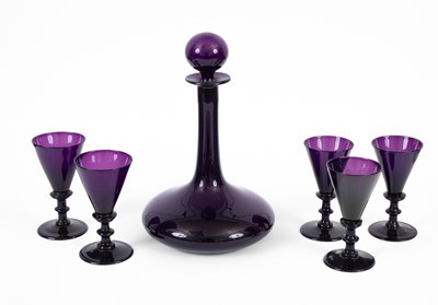 Lot 325 - An amethyst glass onion-shaped decanter and stopper