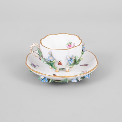 Lot 288 - A small Meissen flower-encrusted cup and saucer