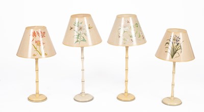Lot 360 - Two pairs of ivory and gilt painted Carolyn Sheffield table lamps