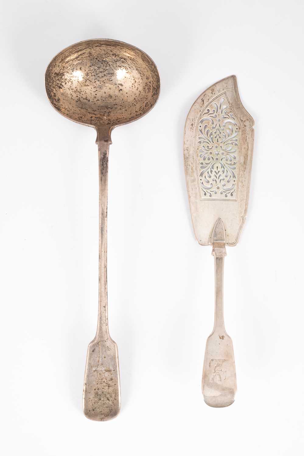 Lot 18 - A Victorian fiddle pattern silver soup ladle and matching fish slice