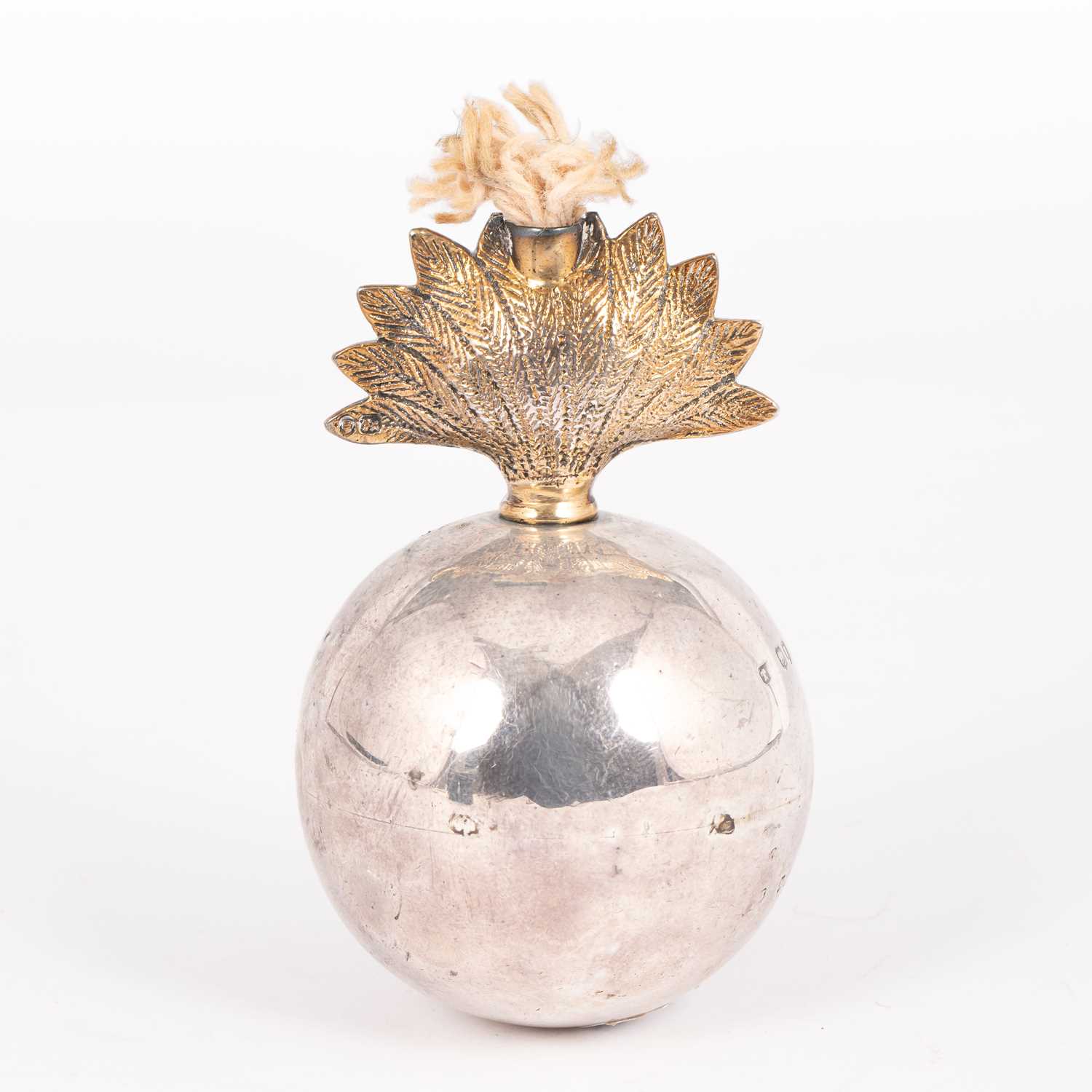 Lot 21 - A silver and silver-gilt table lighter