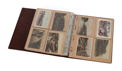 Lot 994 - An album of over 150 early 20th Century postcards
