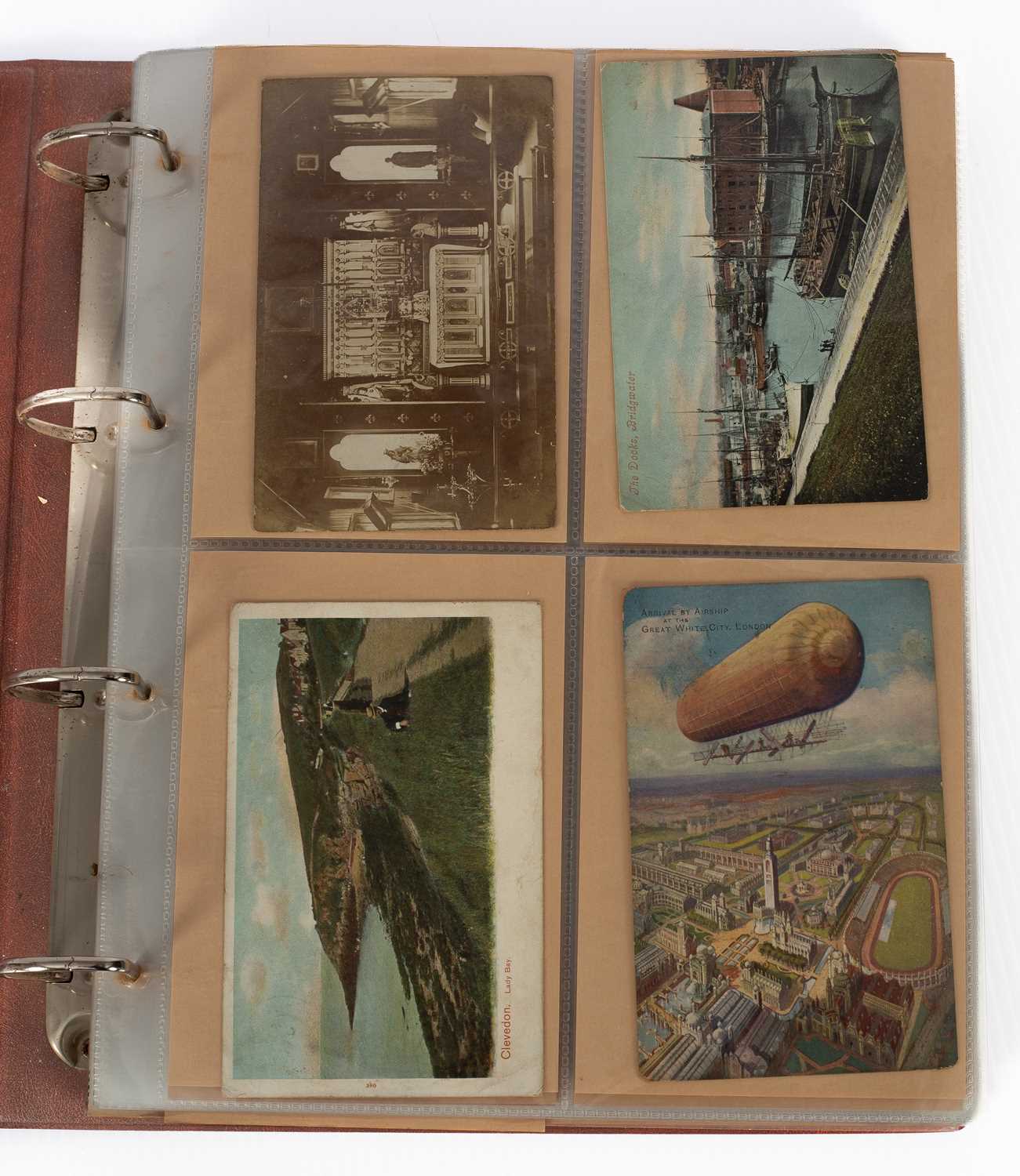 Lot 994 - An album of over 150 early 20th Century postcards