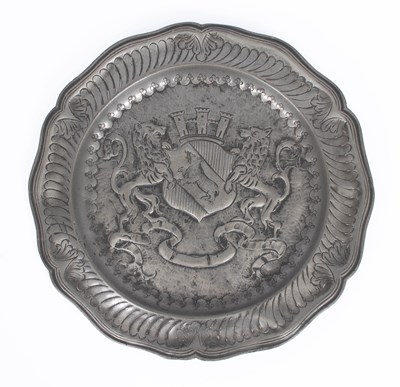 Lot 910 - A pewter armorial charger